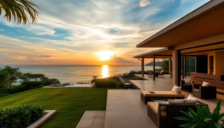 Elegant villa management Phuket: Stunning seaside villa with lush landscape and sunset view.